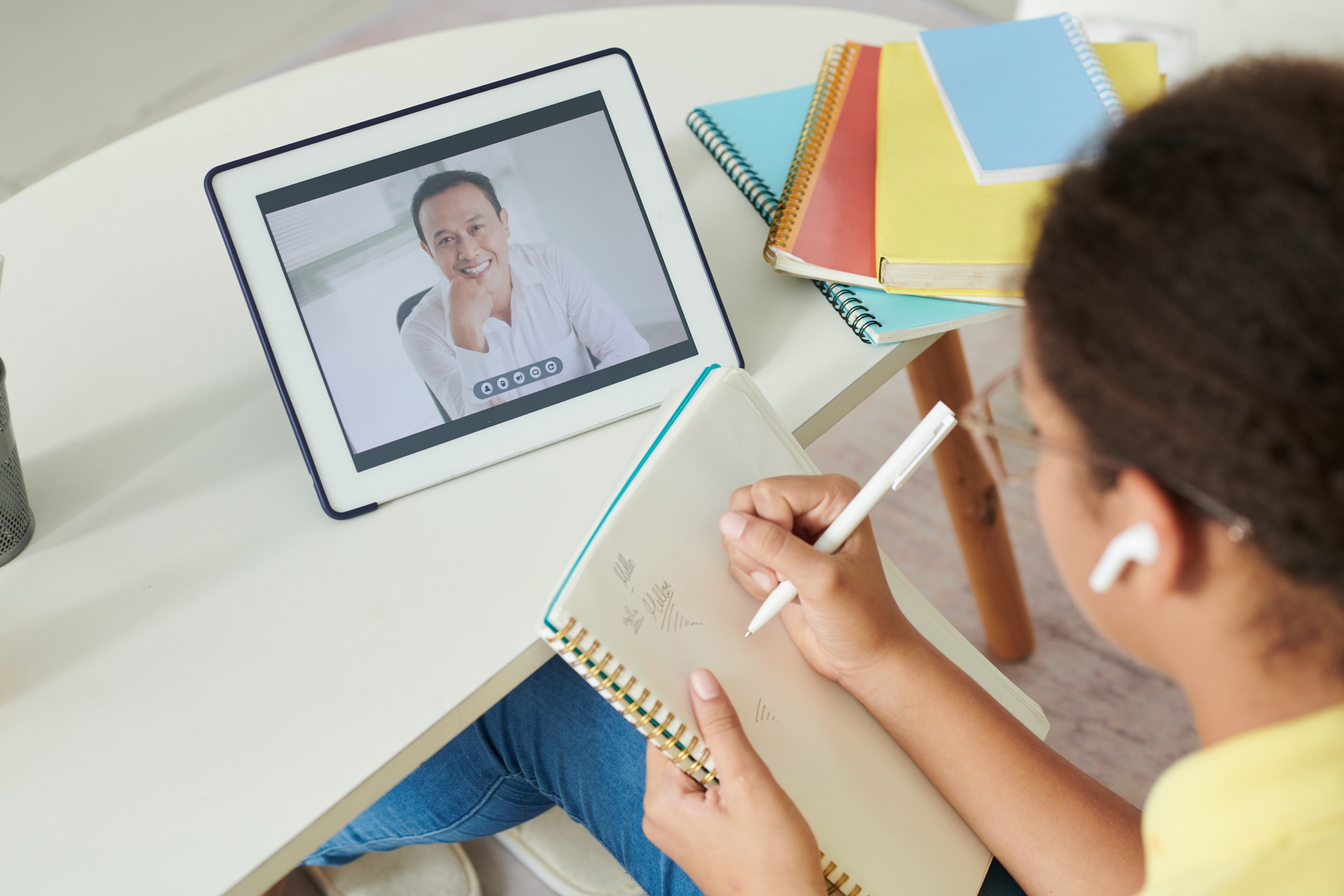 Girl Watching Webinar on Tablet
